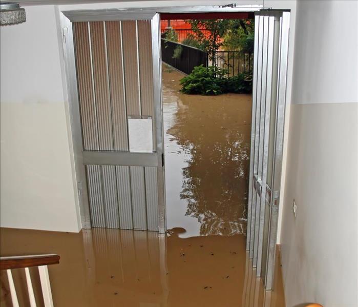 Flooding outside and in stairwell.